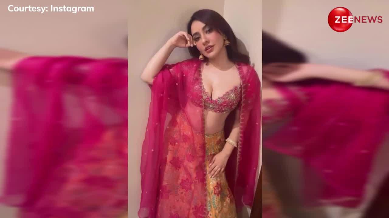 सिजलिंग पिंक-येलो कॉम्बिनेशन के लहंगे में Neha Sharma ने ढाया कहर, देखें वीडियो