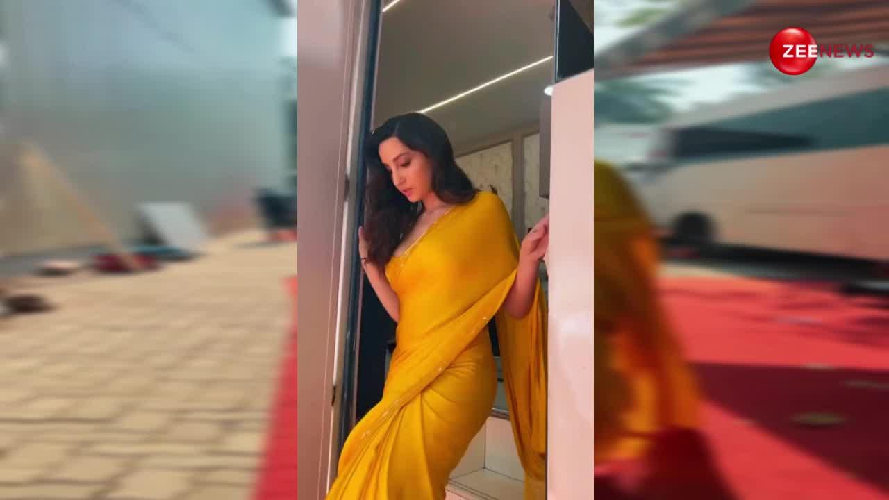 पीली साड़ी पहन Nora Fatehi धीमे-धीमे से चलती हुई आईं, फिर हल्के से कभी झटका पल्लू तो कभी बलखाईं